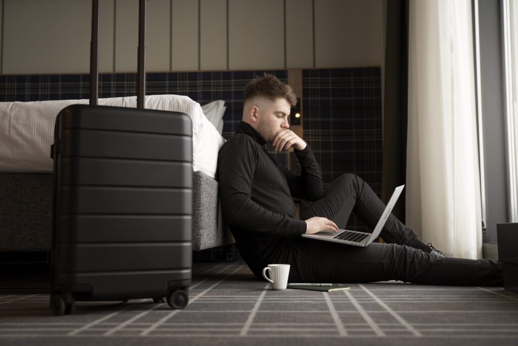 Man preparing for a long flight ahead wearing essential travel men's wardrobe.